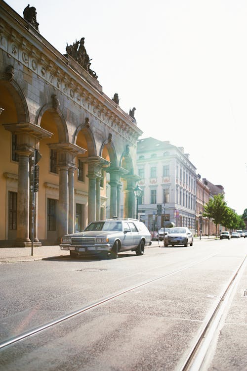 Cars Parked on the Side of the Road Near Buildings