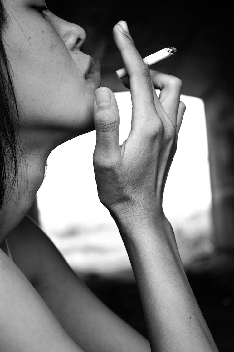 Close Up Of Woman Smoking Cigarette