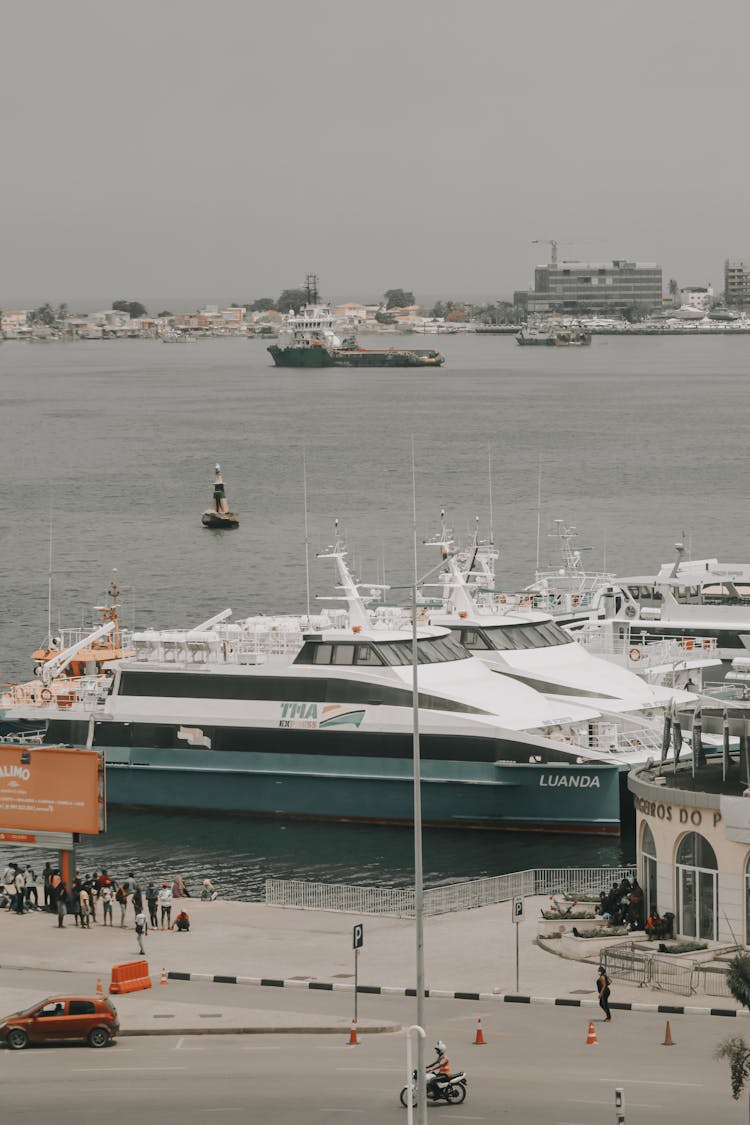 Yachts Docked On The Side Of The Sea