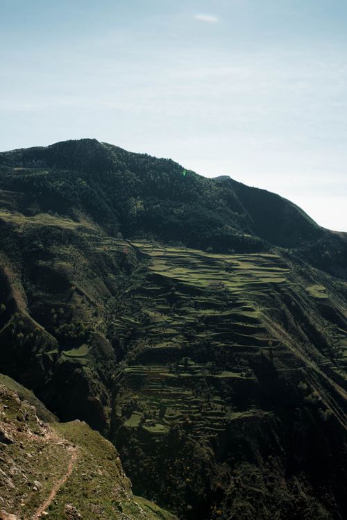 Free Discover breathtaking terraced landscapes in the mountains of Dagestan, Russia, showcasing natural beauty and high-altitude greenery. Stock Photo