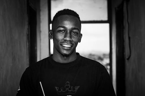 A Smiling Man in Black Crew Neck T-shirt 