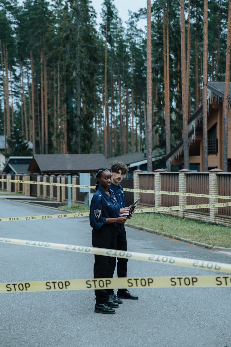 Police Officers Investigating A Case