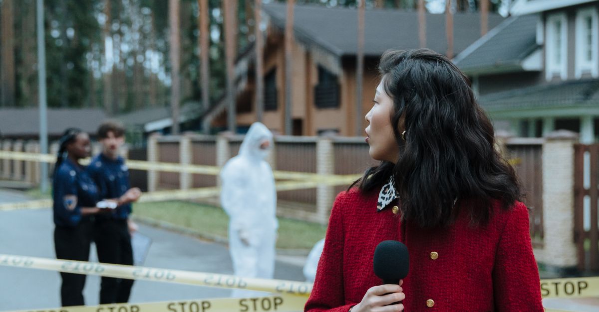 Reporting Scene A Newscaster Reporting while Standing Near the Crime Scene · Free Stock ...
