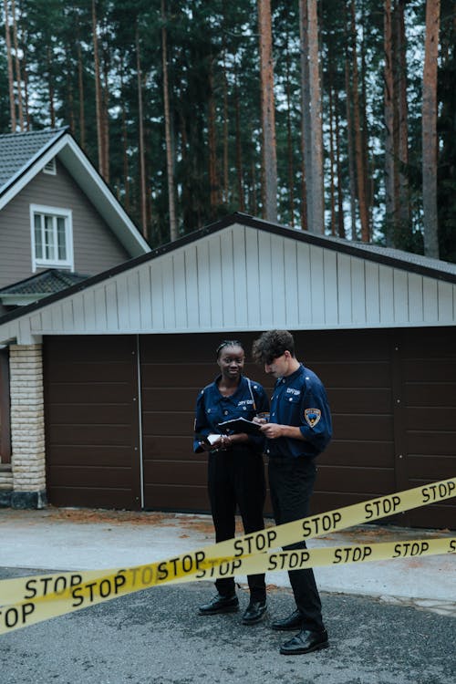 Free Police Officers on the Crime Scene Stock Photo