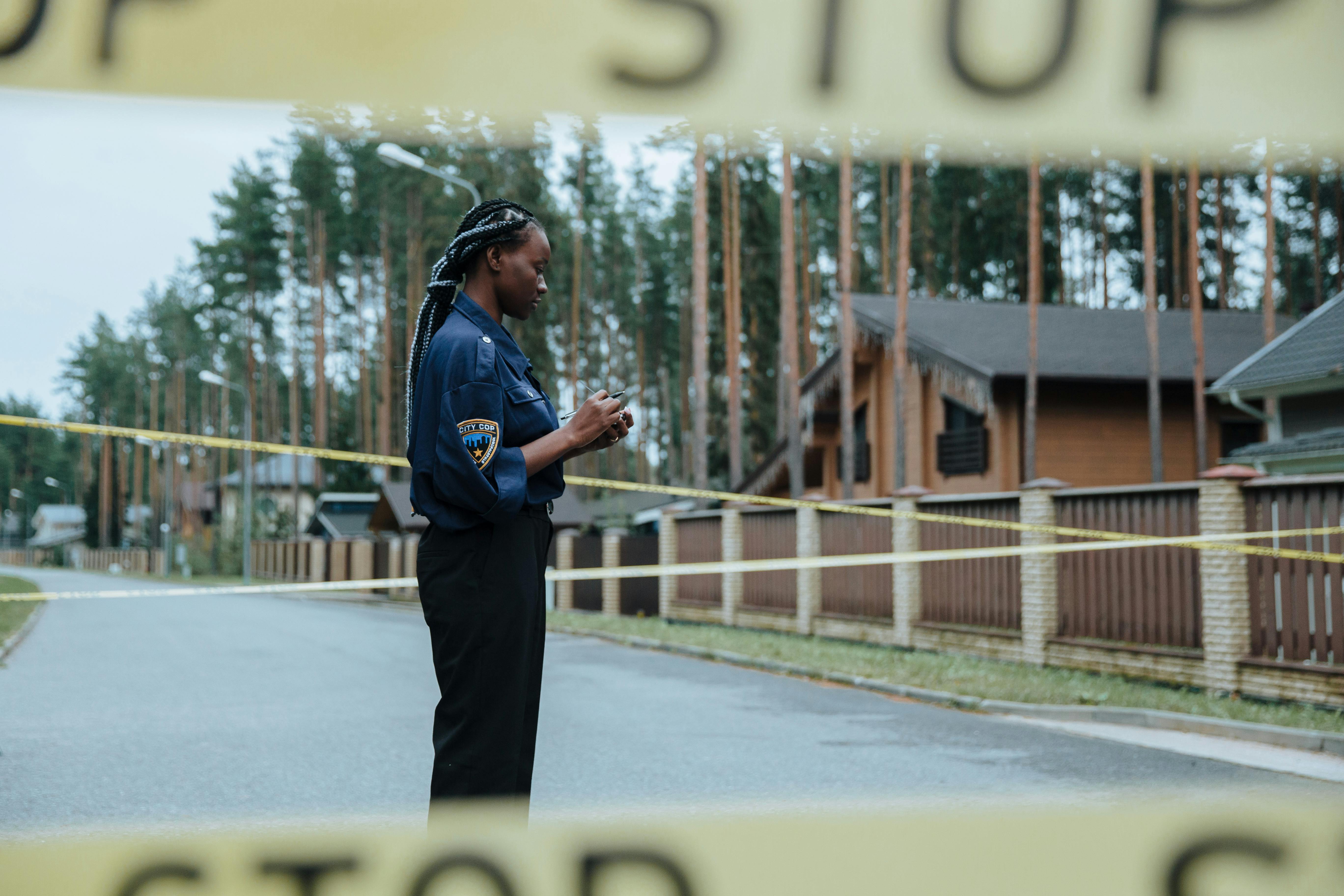 Police Car Behind Barricade Tapes · Free Stock Photo