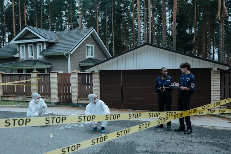 Police Officers Investigating A Crime Scene