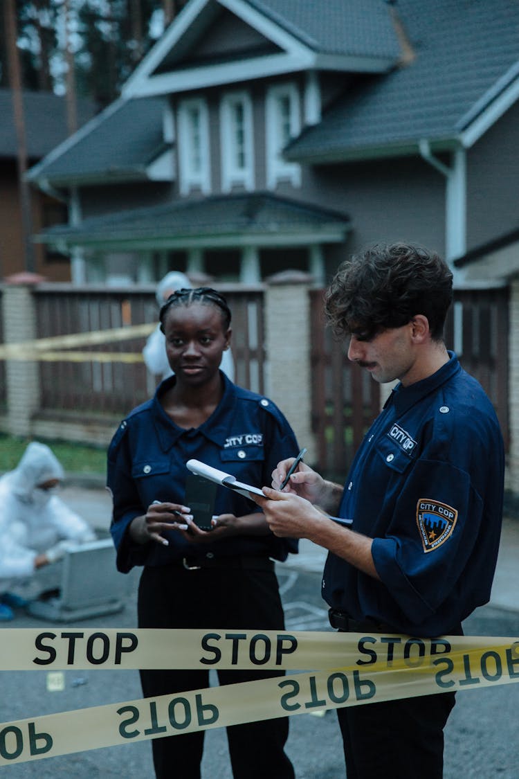 City Cops Investigating The Crime Scene