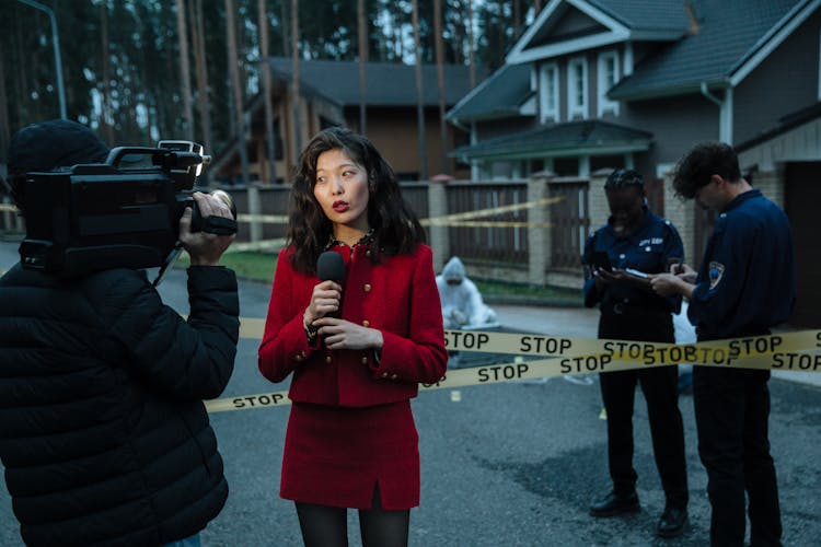 A Group Of People Working In A Crime Scene