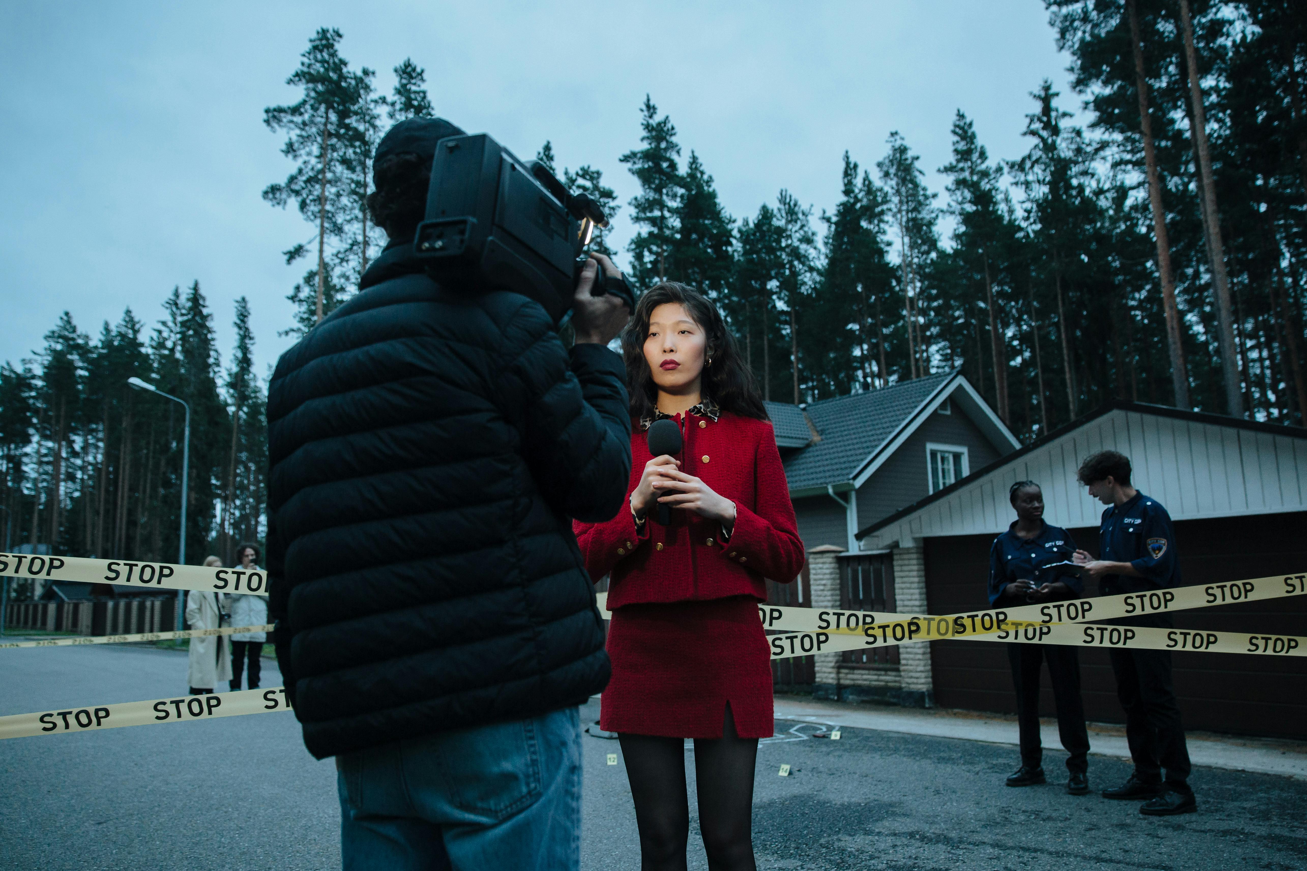 a reporter standing near the crime scene