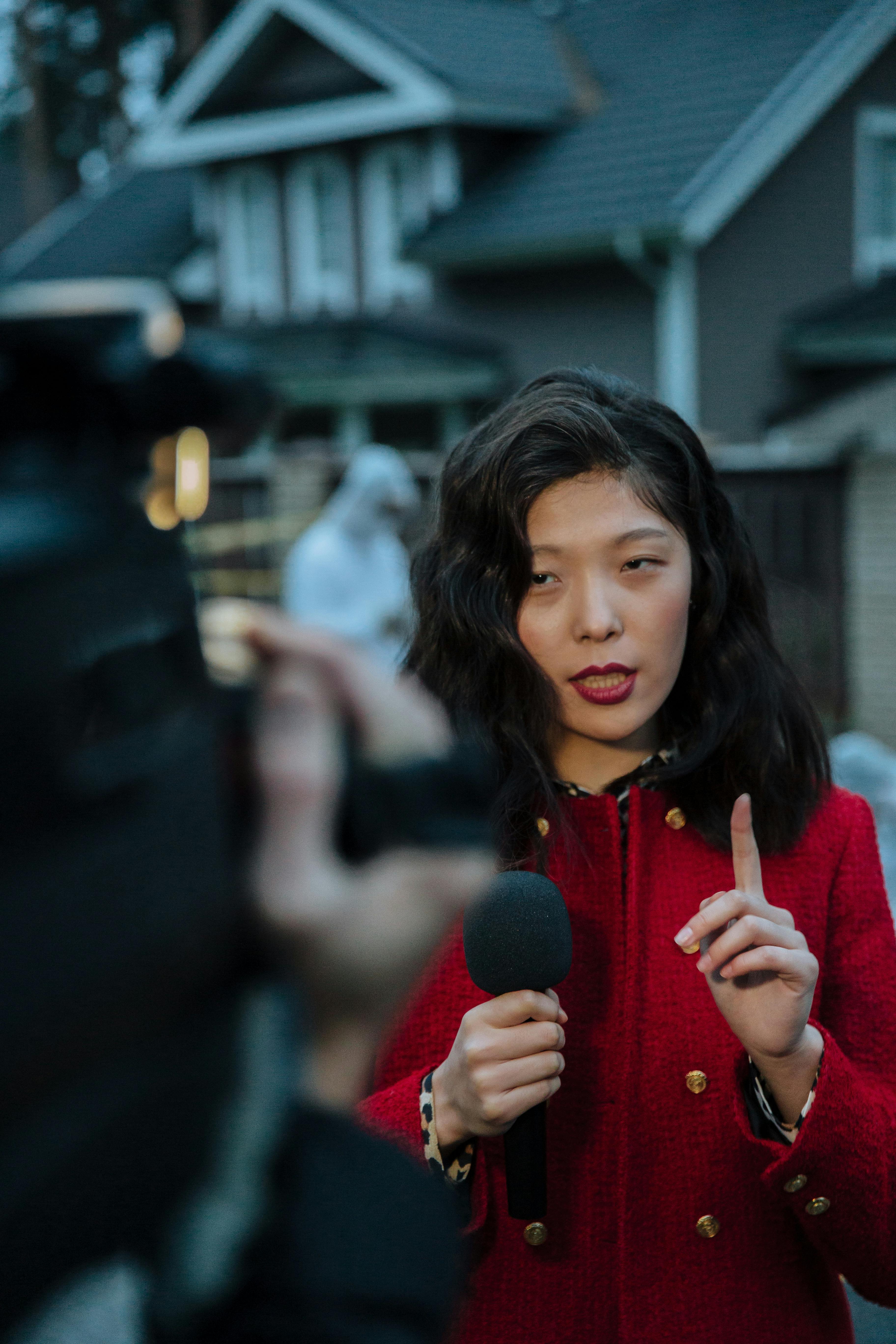 a woman reporting news on the crime scene