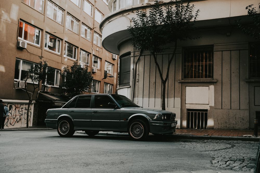 A classic car parked on a city street