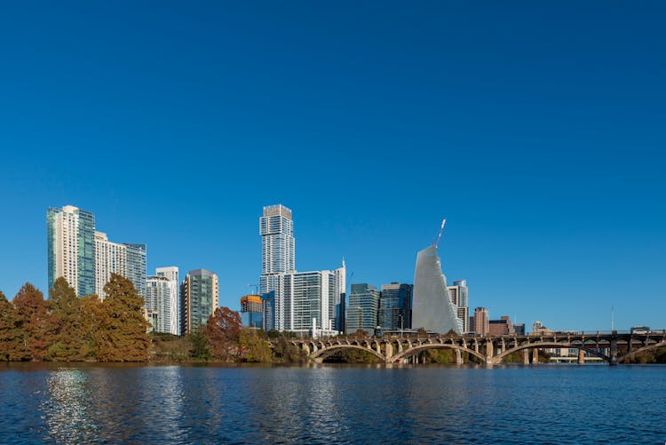 Bridge Over River And City Skyline 