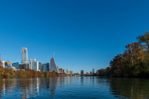 Free Beautiful view of Austin skyline against a clear blue sky over the Colorado River. Stock Photo