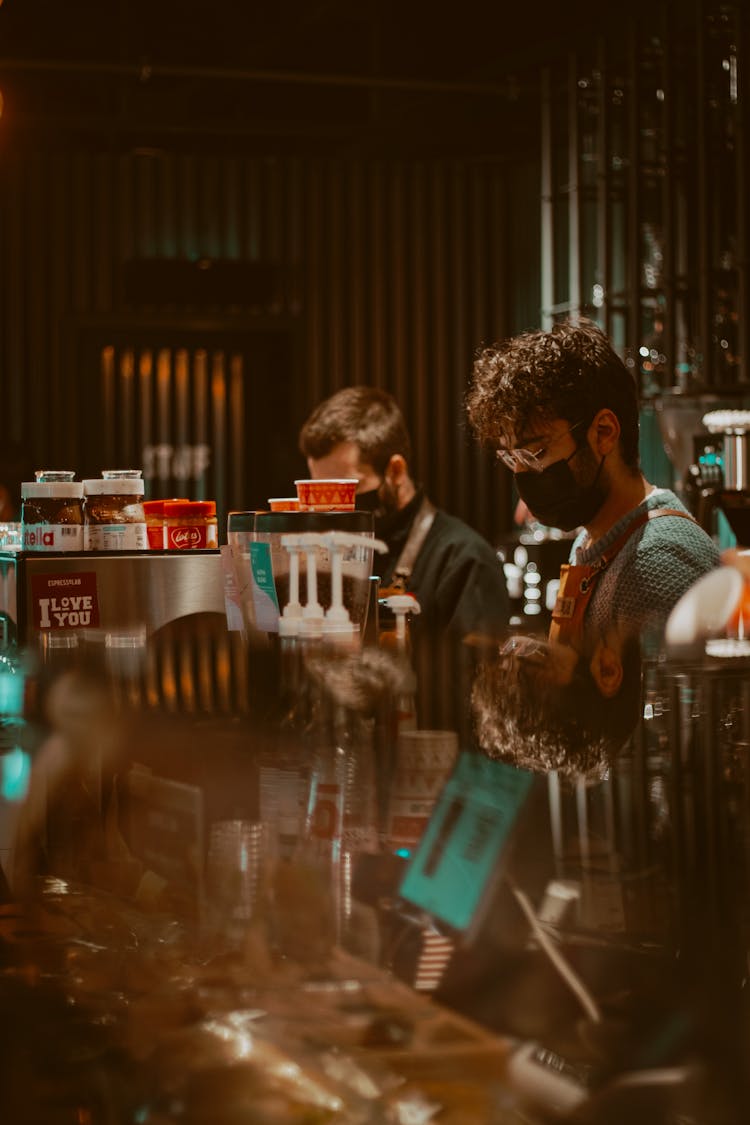 A Barista Wearing Face Mask On The Counter