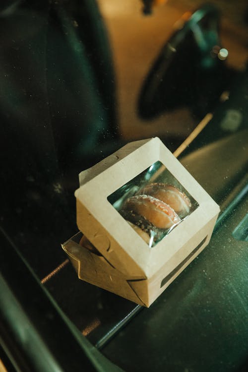 A Box of Donut in the Car Dashboard