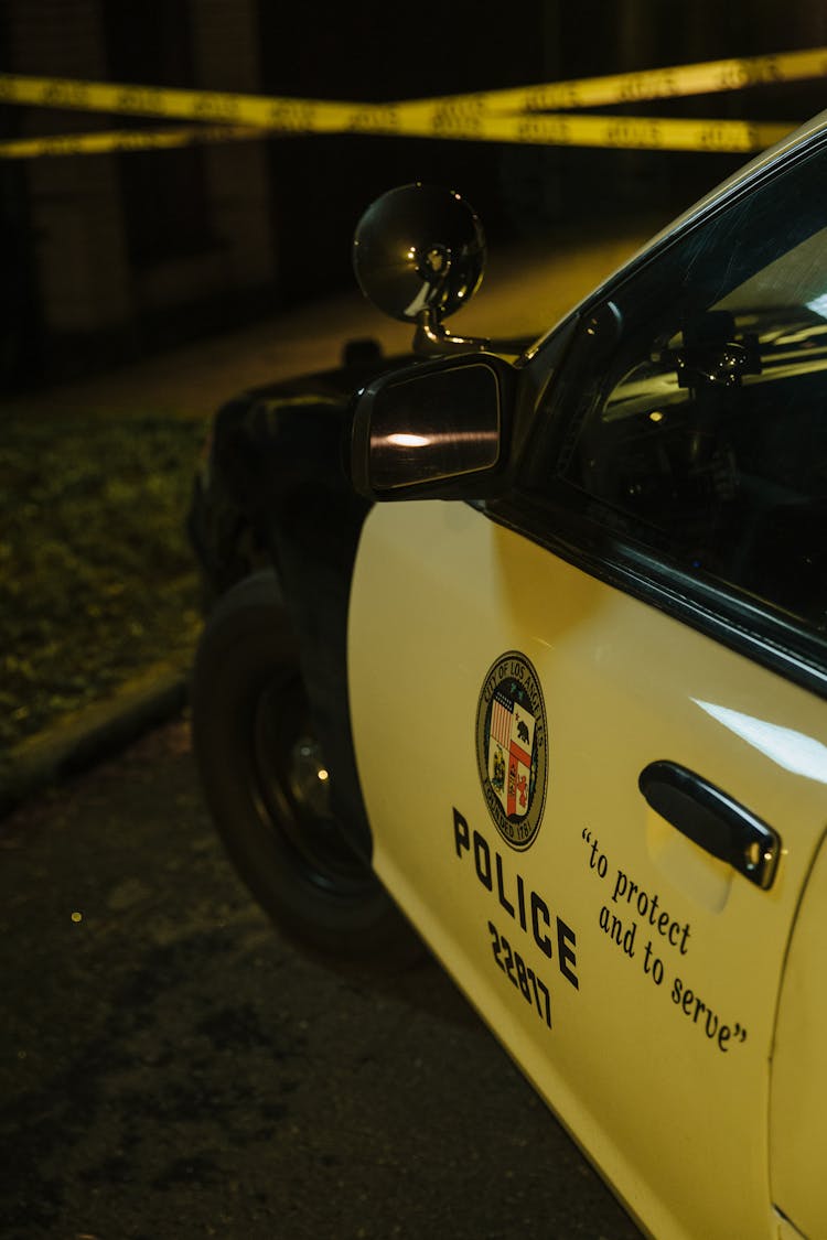 Police Logo Painted On The Police Car Doors