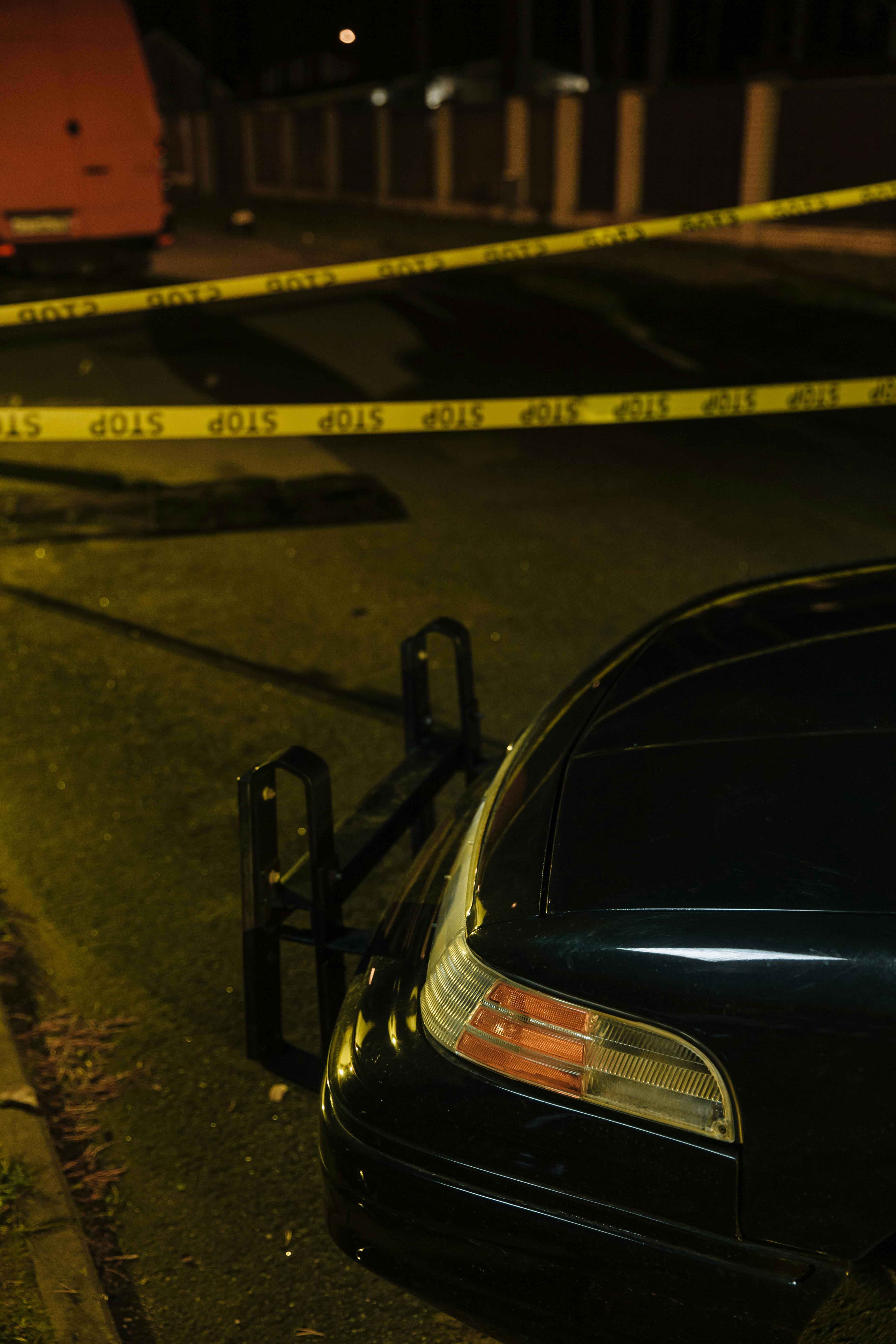 black car on road during night time