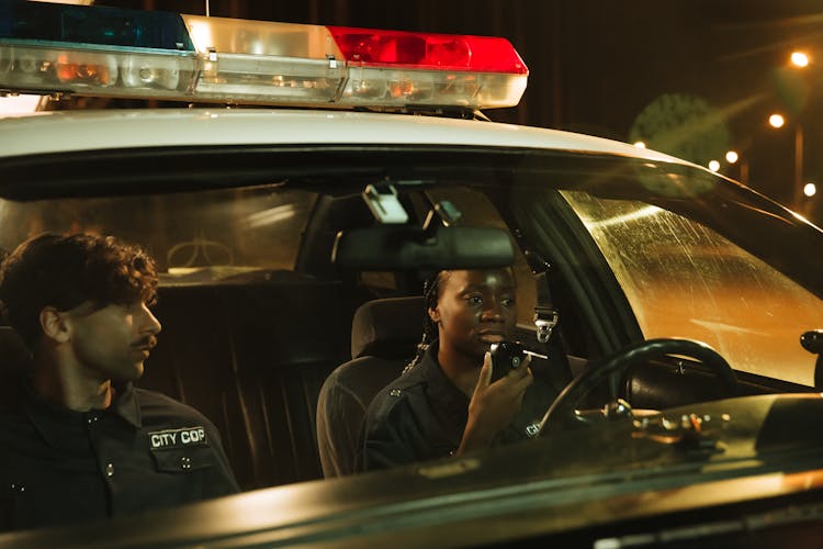 Cops Inside A Parked Police Car