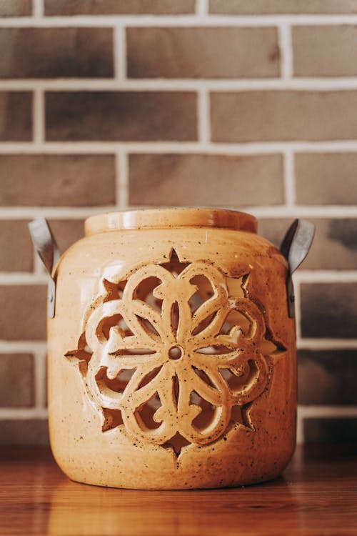 Brown Ceramic Jar With White Flower Design