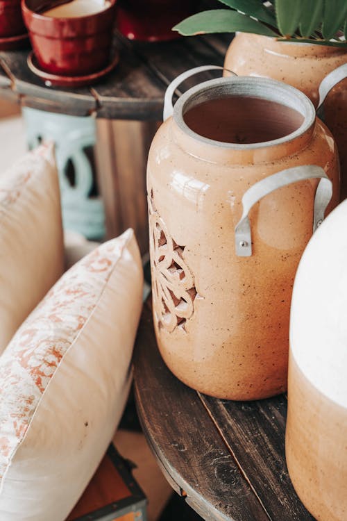 Brown Ceramic Jar on Brown Wooden Table