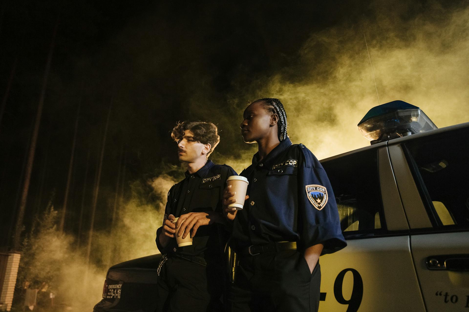 Cops Standing Outside a Parked Police Car