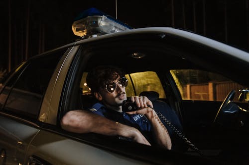 Cop Man inside a Parked Police Car