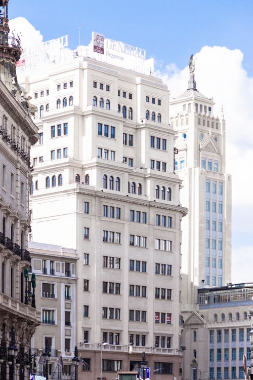 Free Elegant urban architecture in Madrid featuring classic building facades under a clear sky. Stock Photo