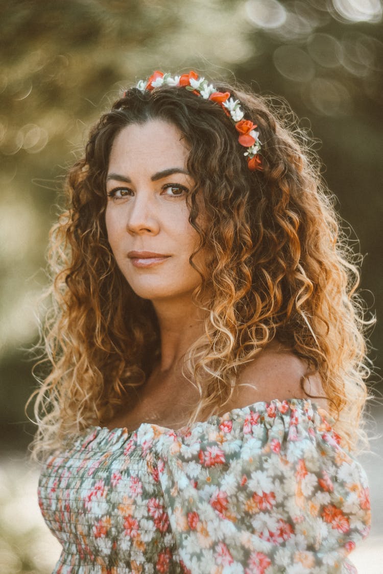  Woman With Long Wavy Hair And Flower Crown in Summer Floral Dress