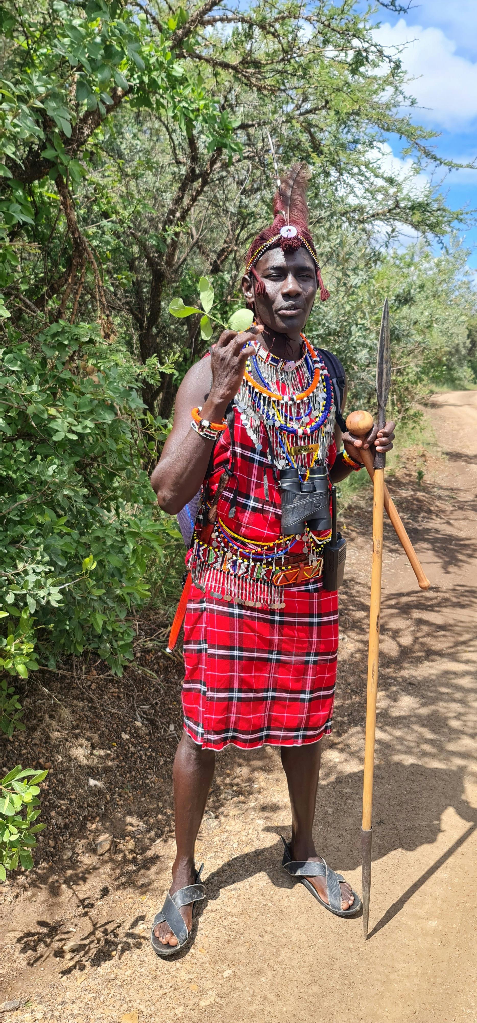 Maasai warrior in traditional dress hi-res stock photography and
