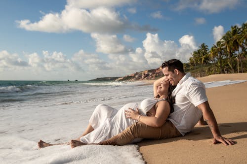 Pregnant Woman and a Man at the Beach