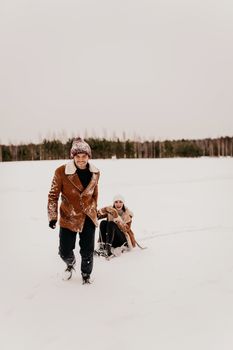 Young Couple Have Playful Time on Sledge