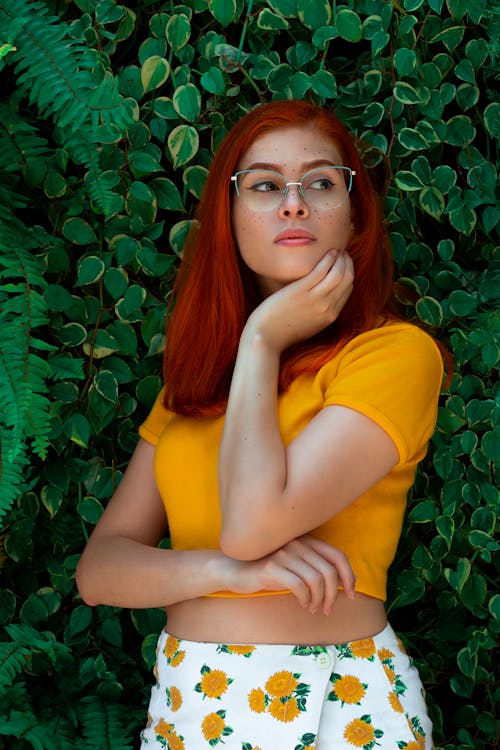 A Woman Posing with a Verdant Background