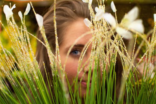 Woman With Blonde Hair Surrounded by Plants