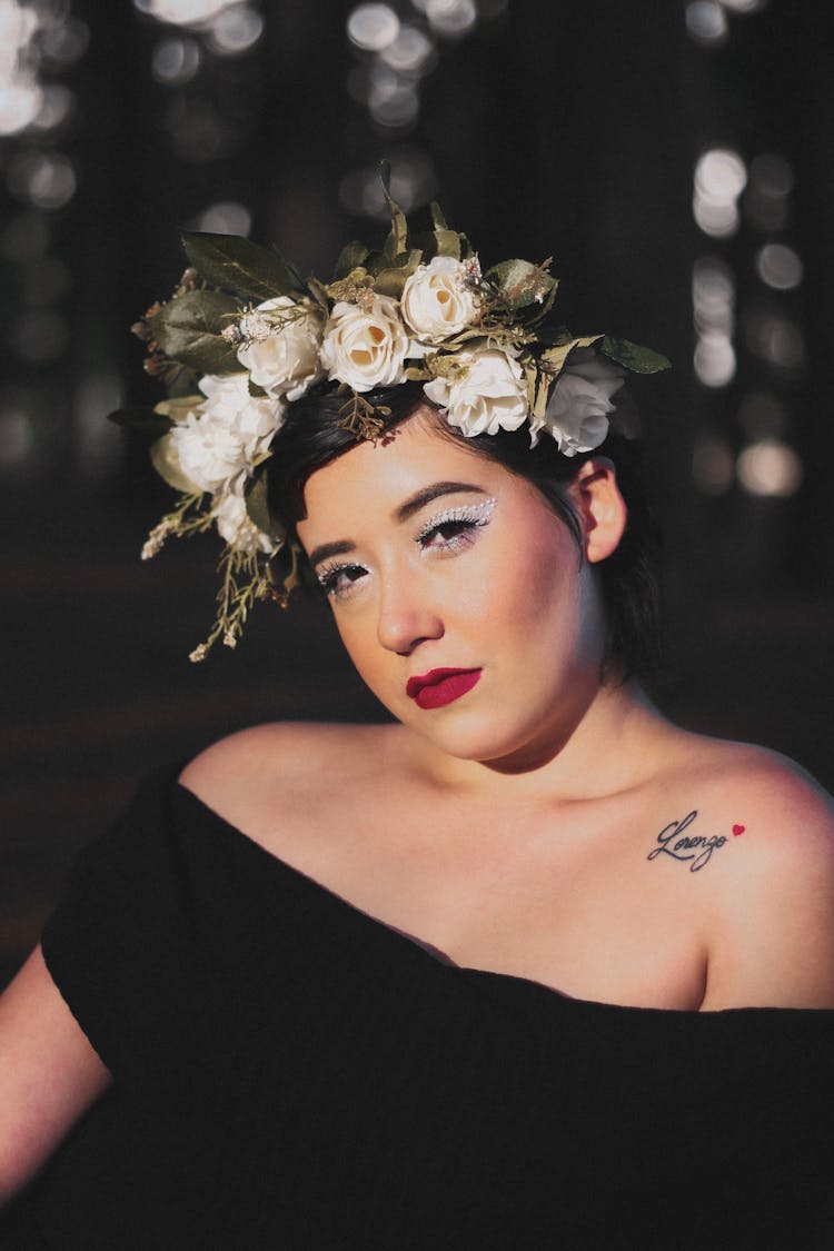 A Woman With Flowers On Her Head