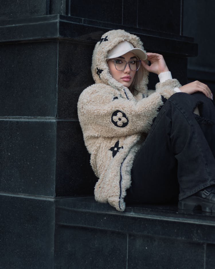 Woman In Hoodie Louis Vuitton Wearing Eyeglasses Sitting 