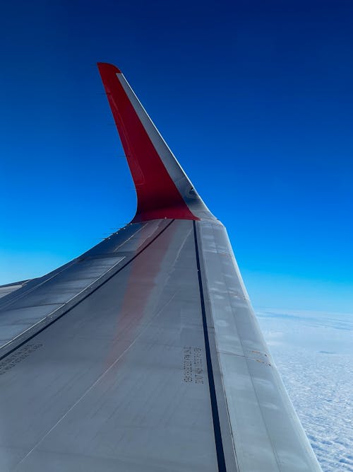 Free Photo of an Airplane Wing Taken from the Airplane Window Stock Photo