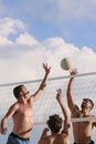 Topless Man Holding White Volleyball