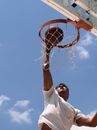 Man in White T-shirt Holding Basketball