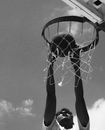 Grayscale Photo of Person Playing Basketball
