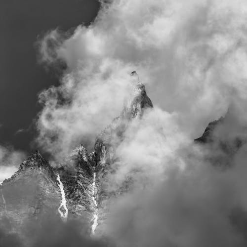 Free Grayscale Photo of Mountain Covered With Clouds Stock Photo