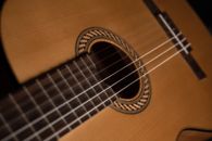 Brown Acoustic Guitar in Close Up Photography