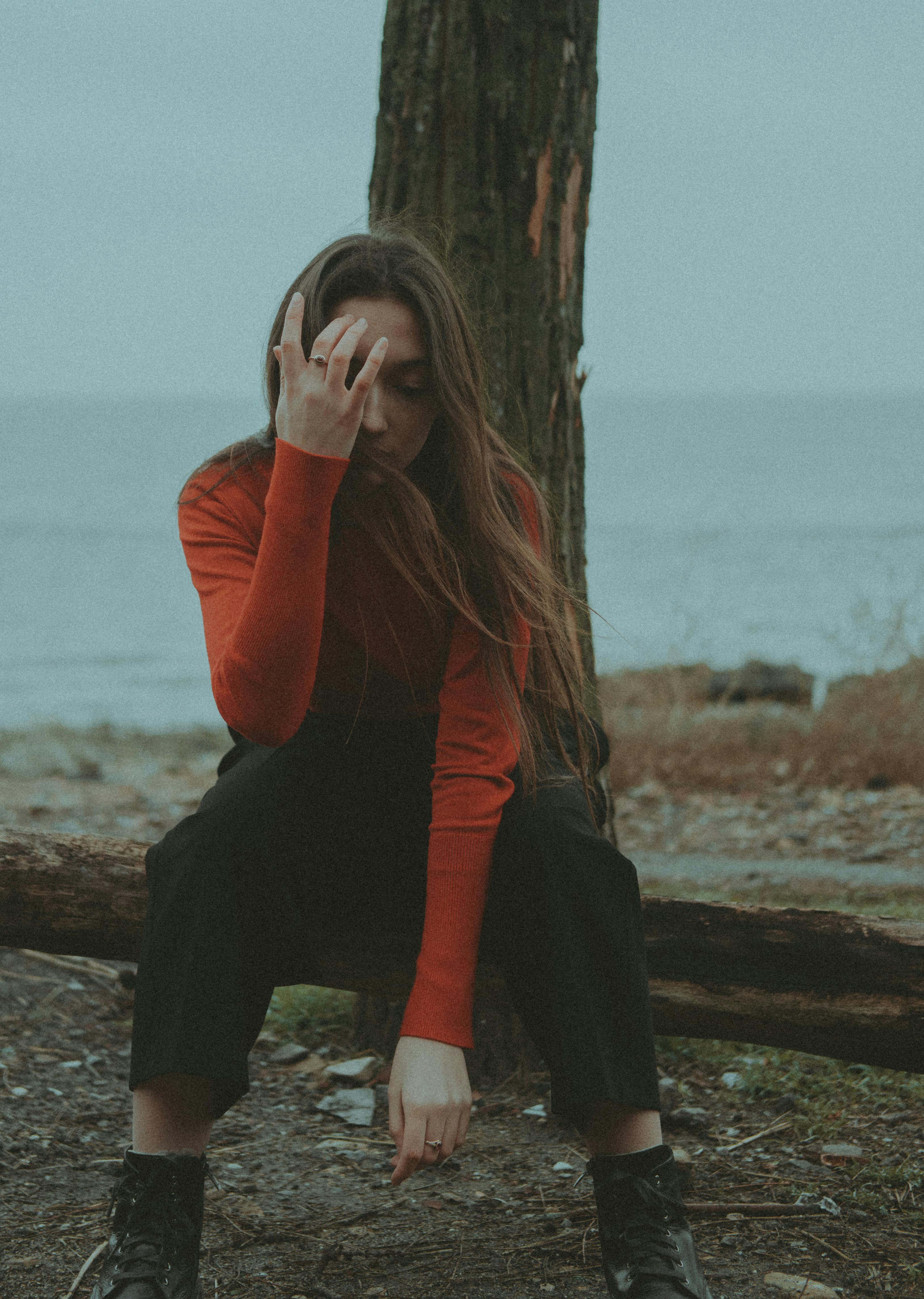 Smiling woman wearing red sweater and black pants photo  Free Sweater  Image on Unsplash