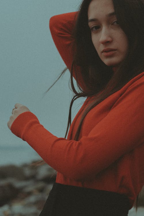 Free Portrait of a Woman Wearing a Red Long Sleeve Top Stock Photo
