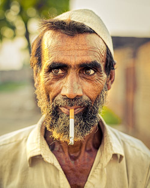 Elderly Man Smoking a Cigarette