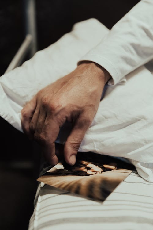 Photo of Woman in Man Hands