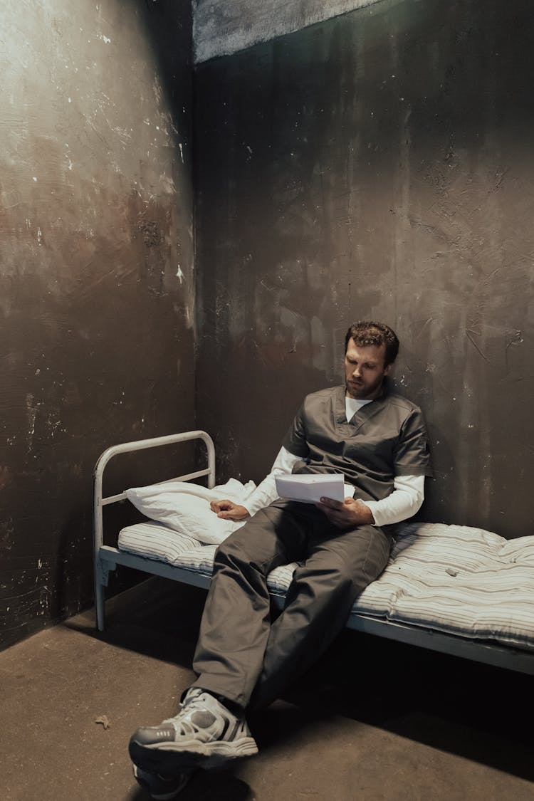 A Prisoner Reading A Letter