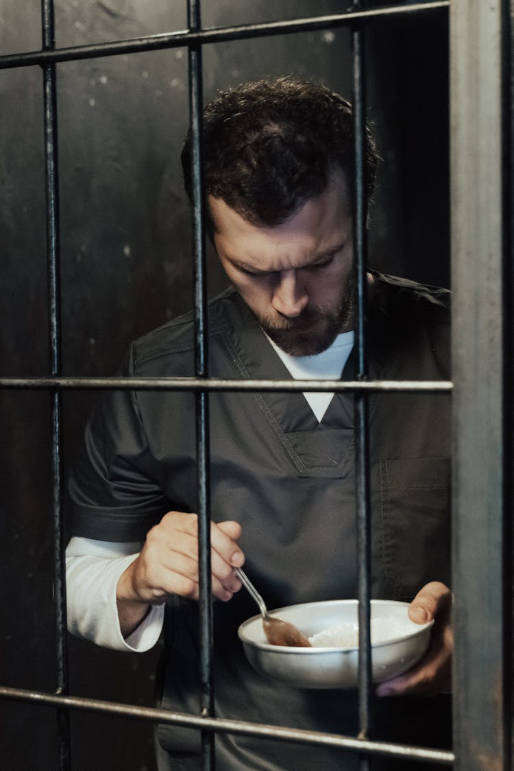 A Prisoner Eating His Food