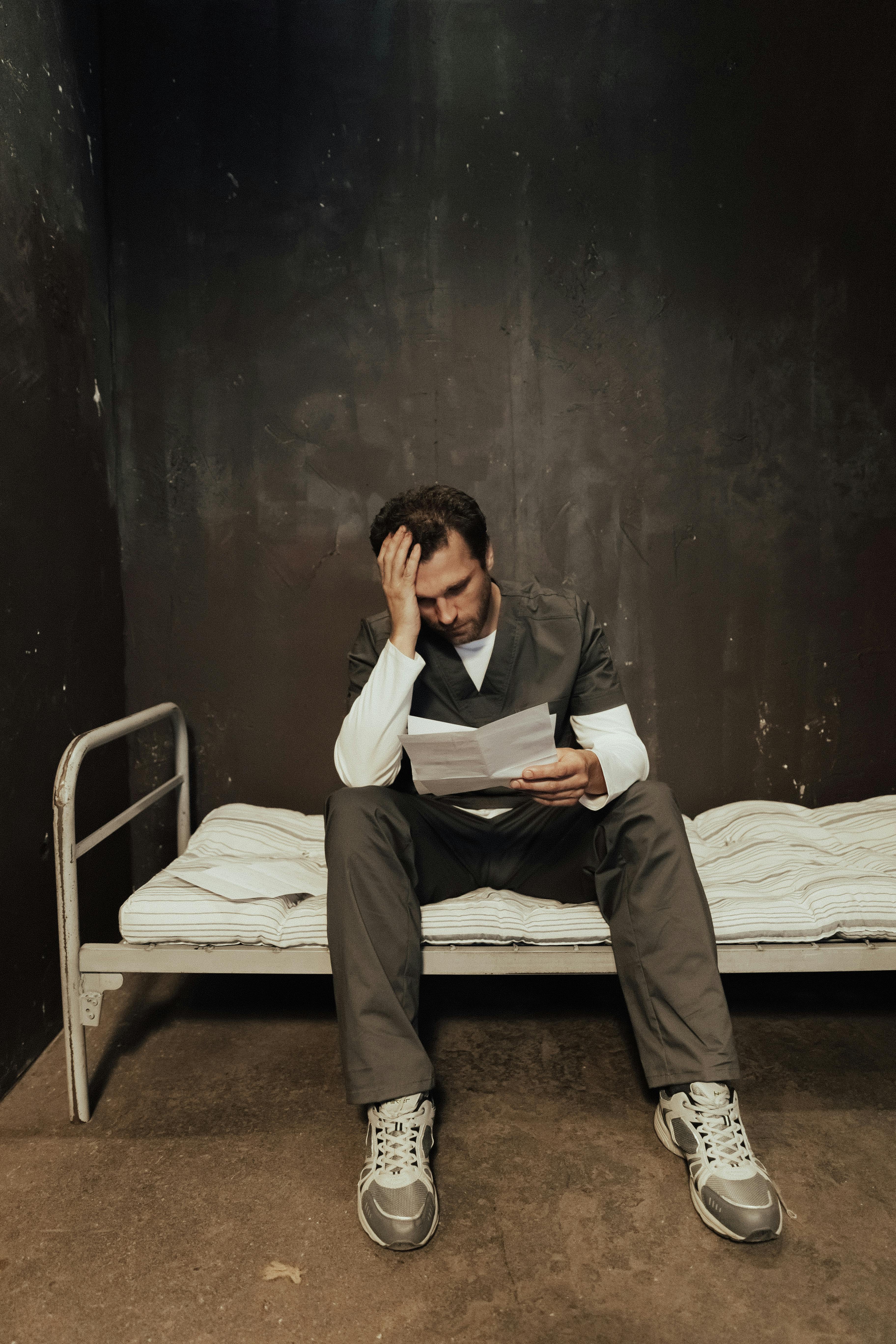 an emotional man reading a letter