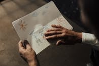 Person Holding White Printer Paper