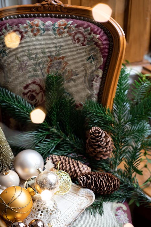 Photograph of Conifer Cones Near Christmas Balls